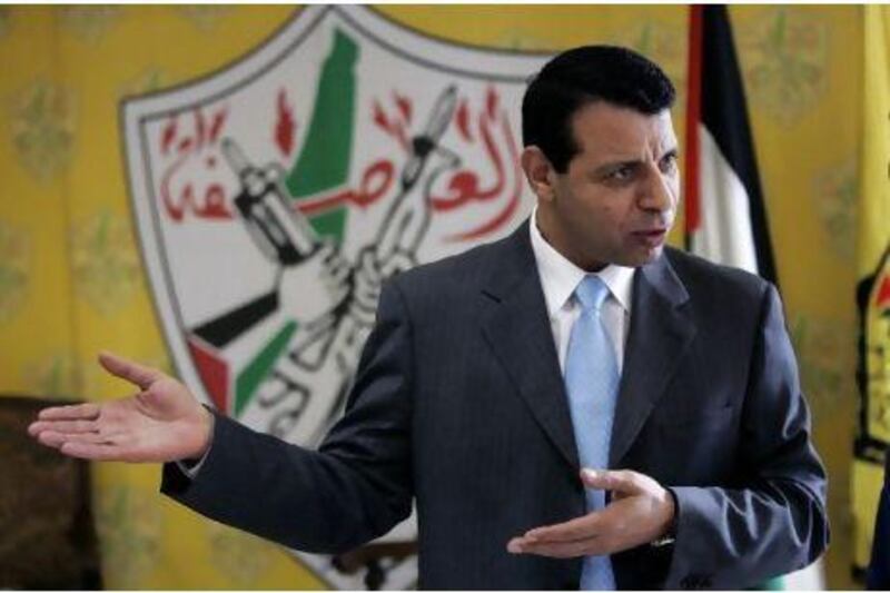 In this Jan. 3, 2011 photo, Palestinian Fatah leader Mohammed Dahlan gestures as he speaks during an interview with The Associated Press in his office in the West Bank city of Ramallah. Not long ago, Mohammed Dahlan was a rising Palestinian leader, a Gaza security chief, darling of the West and adviser to the Palestinian president, even considered a possible successor. But recently, following accusations he conspired against the president, Dahlan has been stripped of his guards, seen his private TV station shuttered and has been frozen out of his Fatah Party's highest body.