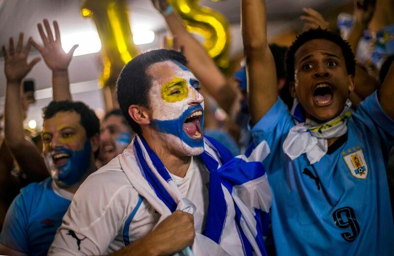 Fans of Uruguay celebrate at the Maracana Stadium in Rio de Janeiro. AFP