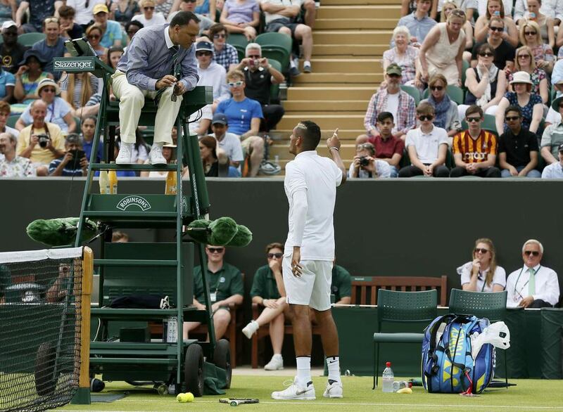 Nick Kyrgios of Australia talks to the umpire during his match against Diego Schwartzman of Argentina at the Wimbledon Tennis Championships in London, June 29, 2015.   REUTERS/Stefan Wermuth