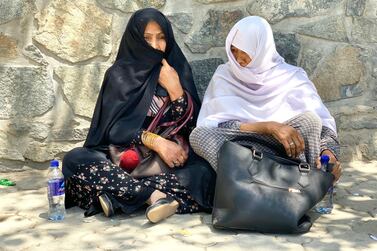 Afghans look for the names of their relatives and friends outside the emergency trauma hospital in Kabul. An ISIS suicide bomber detonated himself in a crowded wedding hall in the Afghan capital on Saturday night, killing 63 and injuring 180 guests. Hikmat Noori for The National