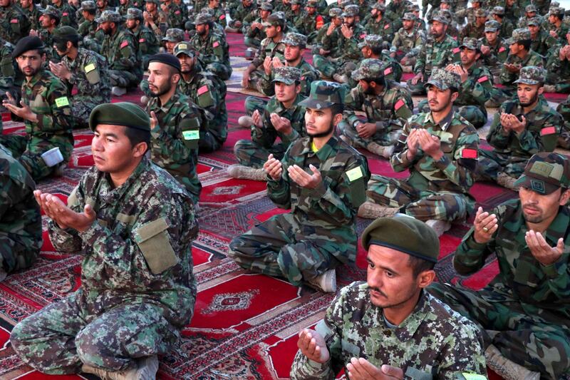 Soldiers of the Afghan National Army pray after breaking the fast during the Muslim holy month of Ramadan in Herat, western Afghanistan. Ramadan is the ninth month in the Islamic calendar and it is believed that the revelation of the first verse of the Quran was made to the Prophet Mohammed during the last 10 nights of the month. EPA