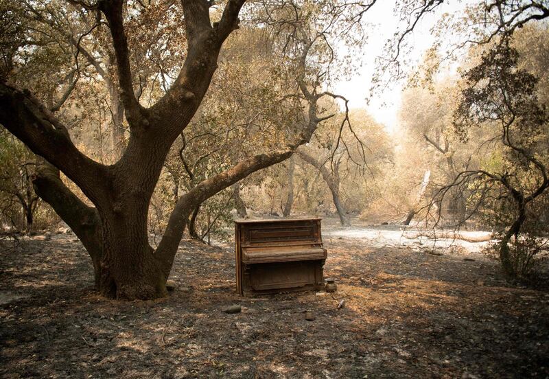 A piano sits near the charred remains of a residence in Vacaville, California.  AFP