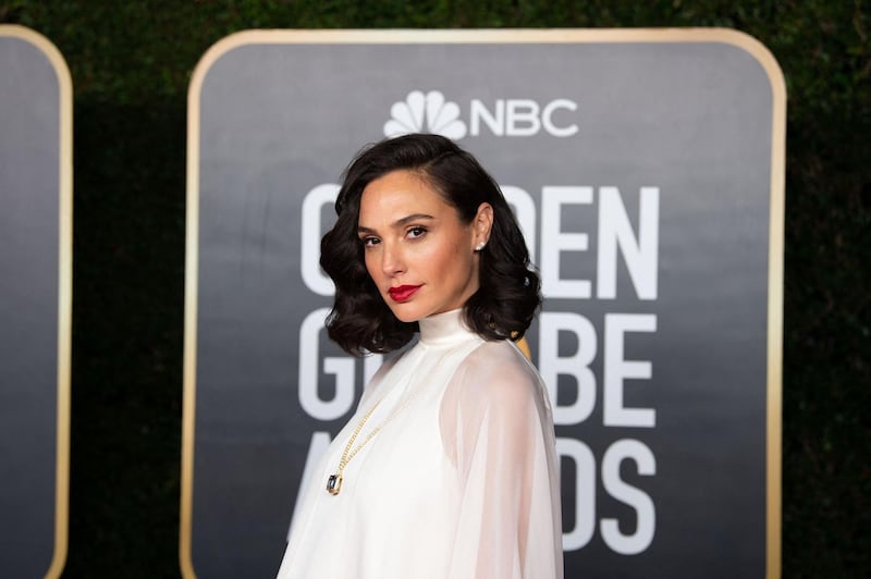 This handout photo courtesy of the HFPA shows Gal Gadot arriving for the 78th Annual Golden Globe Awards in Beverly Hills, California on February 27, 2021. Usually a star-packed, laid-back party that draws Tinseltown's biggest names to a Beverly Hills hotel ballroom, this pandemic edition will be broadcast from two scaled-down venues, with frontline and essential workers among the few in attendance. - RESTRICTED TO EDITORIAL USE - MANDATORY CREDIT "AFP PHOTO / HFPA " - NO MARKETING - NO ADVERTISING CAMPAIGNS - DISTRIBUTED AS A SERVICE TO CLIENTS
 / AFP / HFPA / - / RESTRICTED TO EDITORIAL USE - MANDATORY CREDIT "AFP PHOTO / HFPA " - NO MARKETING - NO ADVERTISING CAMPAIGNS - DISTRIBUTED AS A SERVICE TO CLIENTS
