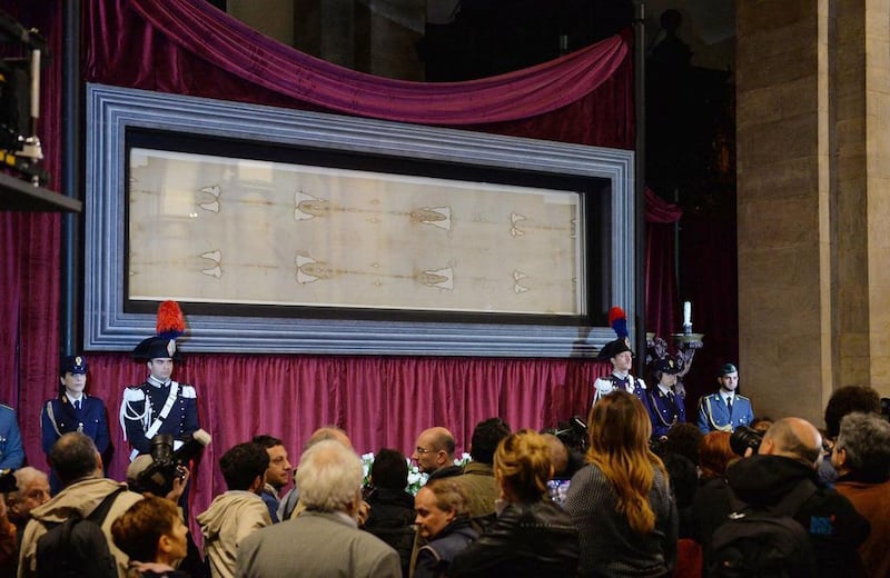 People look at the Holy Shroud of Turin during a press preview at the Cathedral of Turin, in Turin, Italy, on April 18, 2015. Alessandro Di Marco/EPA