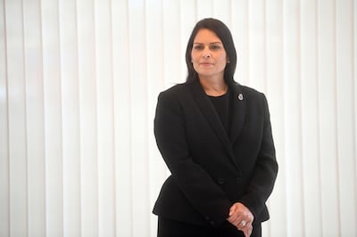 Britain's Home Secretary Priti Patel looks on ahead of a minute's silence inside the atrium at Scotland Yard in London on September 25, 2020, following the shooting of a British police officer by a 23-year-old man being detained at the centre. - A British police officer was shot dead in the early hours of Friday morning, Scotland Yard said, the first officer to be killed by gunfire while on duty in over eight years. (Photo by Victoria Jones / POOL / AFP)