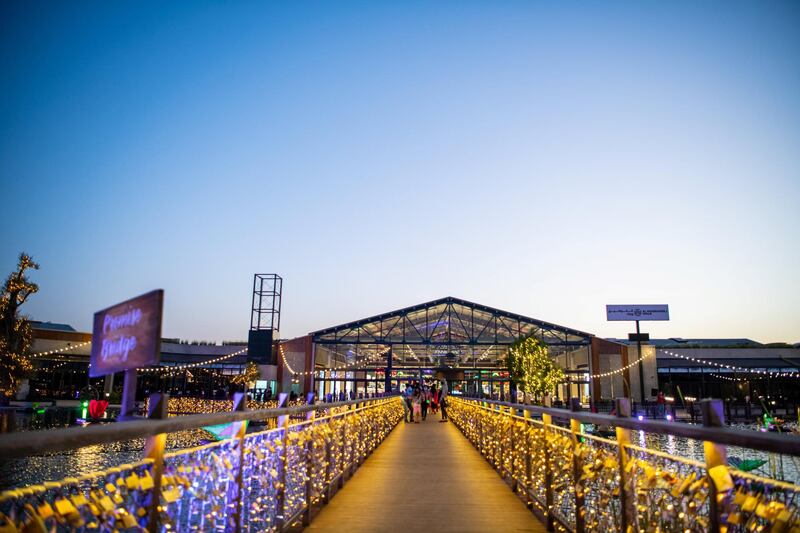 The mall sprawls across both indoor and outdoor areas, with the outdoor space landscaped around a lake.