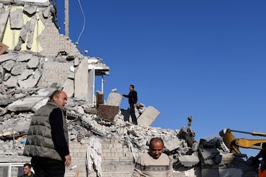 Emergency workers clear debris at a damaged building in Thumane, 34 kilometres northwest of Albania's capital Tirana, after an earthquake on November 26. AFP