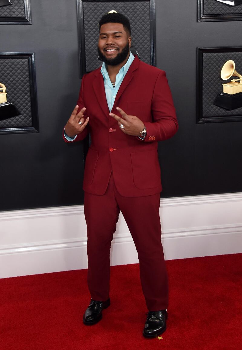 Khalid went for a burgundy suit and pale blue shirt for the 62nd annual Grammy Awards . AP