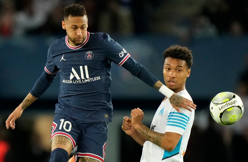 PSG's Neymar, left, controls the ball. AP Photo 