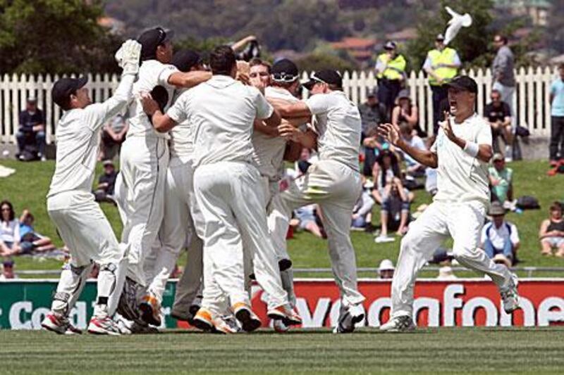 New Zealand players celebrate as they secure victory over Australia.