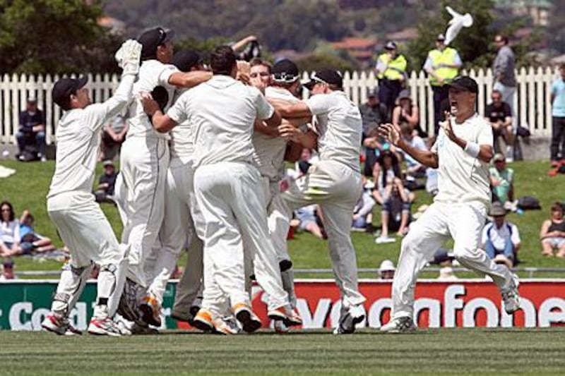 New Zealand players celebrate as they secure victory over Australia.