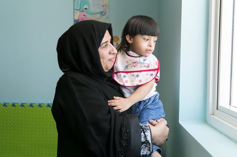 FUJAIRAH, UNITED ARAB EMIRATES - JULY 3, 2018. 
Ali Ahmed Al Bulooshi, 3, with his mother, Mona Ali Mubarak Al Kindi, at a therapy session in Dimensions Center in Fujairah. The center which treats children of special needs, has been saved from closure after the community rallied around to help. 

(Photo by Reem Mohammed/The National)

Reporter: Ruba Haza
Section: NA