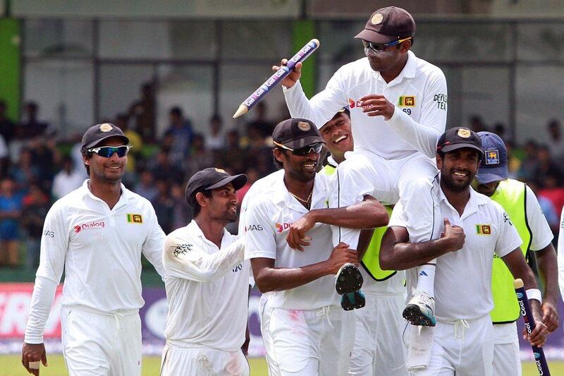 Mahela Jayawardene, above, is carried by teammates after the conclusion of his final Test match with Sri Lanka against Pakistan on Monday. MA Pushpa Kumara / EPA / August 18, 2014
