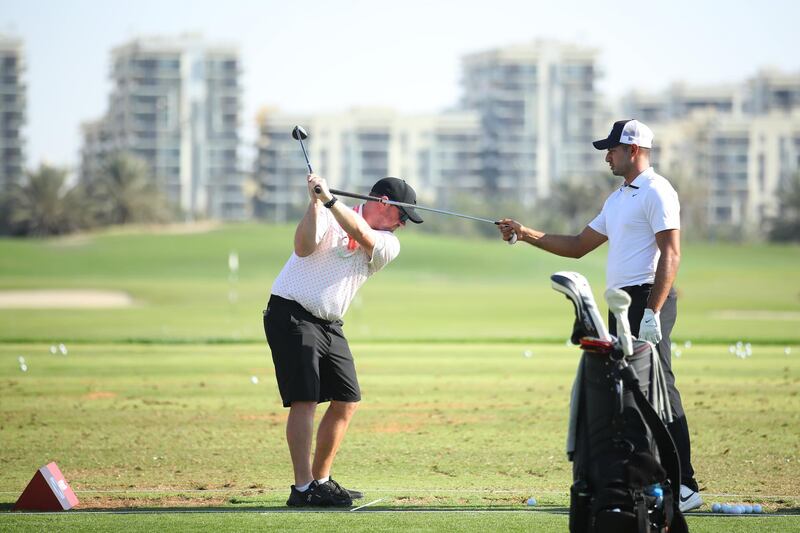 Julian Suri of the US gives swing advice to his caddie. Getty Images
