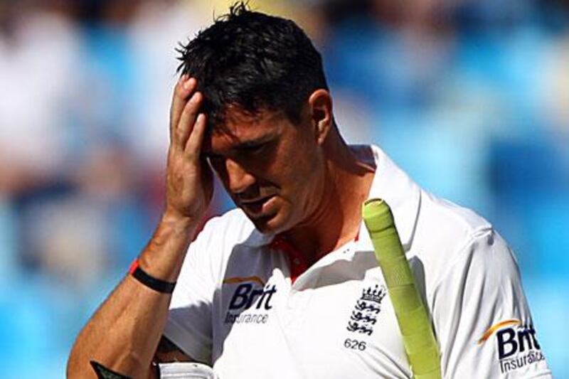 Kevin Pietersen walks back to the pavilion after his dismissal in the Test match between Pakistan and England at the Dubai International Cricket Stadium