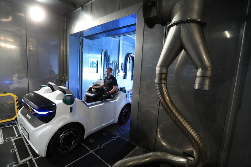 An employee rides in a Schaeffler Mover electric autonomous vehicle during testing in the Schaeffler AG factory in Herzogenaurach, Germany, on Tuesday July 3, 2018. Schaeffler, the ball-bearings maker and automotive supplier, surged after lifting its revenue forecast for the industrial division and reporting higher-than-expected second-quarter profit. Photographer: Krisztian Bocsi/Bloomberg