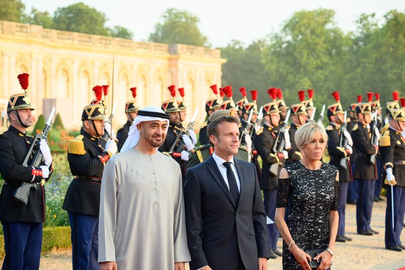 Sheikh Mohamed, Mr Macron and France's first lady Brigitte Macron at the Versailles Grand Trianon. Photo: Presidential Court