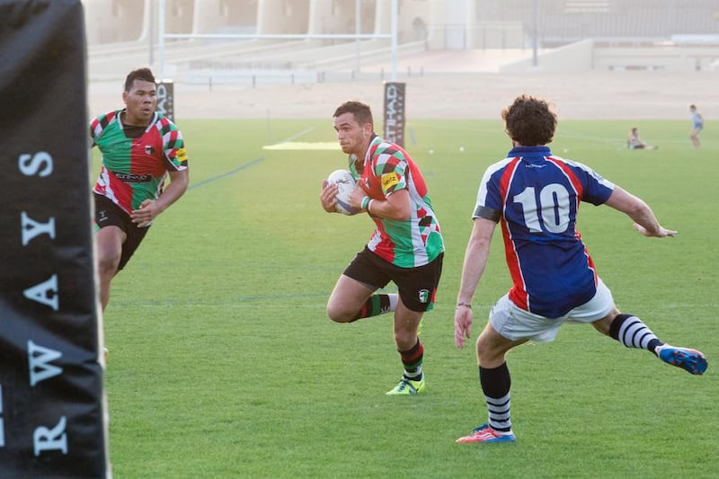 The Jebel Ali Dragons and Abu Dhabi Harliquins in action at Zayed Sports City on Friday. Duncan Chard for the National