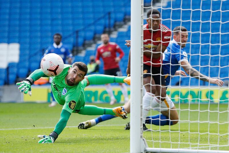 Brighton's Lewis Dunk and Manchester United's Bruno Fernandes challenge for the ball. Reuters