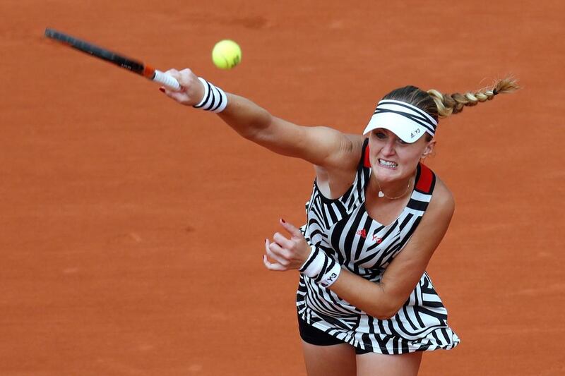 France’s Kristina Mladenovic returns the ball to US player Serena Williams during their women’s third round match at the Roland Garros 2016 French Tennis Open in Paris on May 28, 2016. / AFP / Thomas SAMSON