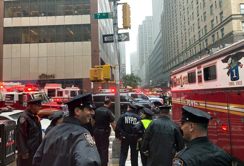 New York police officers monitor the streets near 51st Street and 7th Avenue. AP Photo