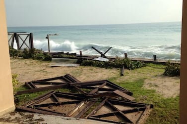 The Miramar Al Aqah Beach Resort said waves crashed through fences, swept furniture out to sea and left debris and sludge in its restaurant. Courtesy: Ashraf Helmy
