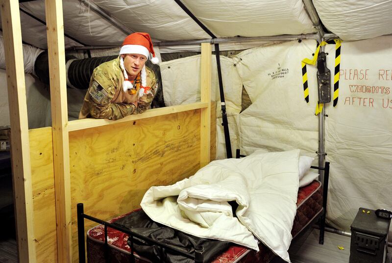 epa03549754 A picture dated 12 December 2012 shows Britain's Prince Harry or just plain Captain Wales as he is known in the British Army, showing a TV crew his sleeping area and bed at the VHR (very high readiness) tent close to the flight-line, at Camp Bastion southern Afghanistan, where he served as an Apache Helicopter Pilot/Gunner with 662 Sqd Army Air Corps, from September 2012 for four months until January 2013. Prince Harry ended his five-month deployment in Afghanistan on 21 January 2013 with an admission during a BBC interview that he shot at Taliban insurgents as a co-pilot gunner in an Apache attack helicopter. He remarked: 'Take a life to save a life'.  EPA/JOHN STILLWELL / PA WIRE / POOL UK AND IRELAND OUT *** Local Caption ***  03549754.jpg