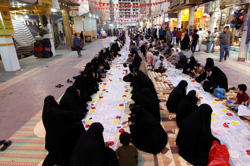 Muslims gather to break their fast on a street in Najaf, Iraq. Reuters