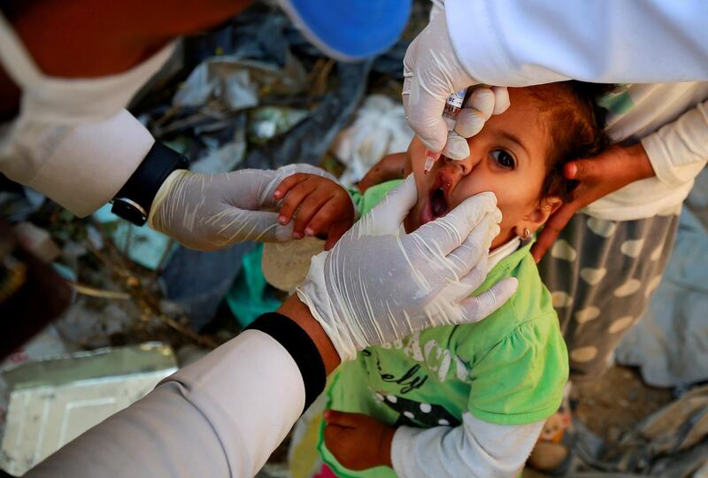 A girl receives a polio vaccine during a three-day immunisation campaign in Sanaa, Yemen. Reuters