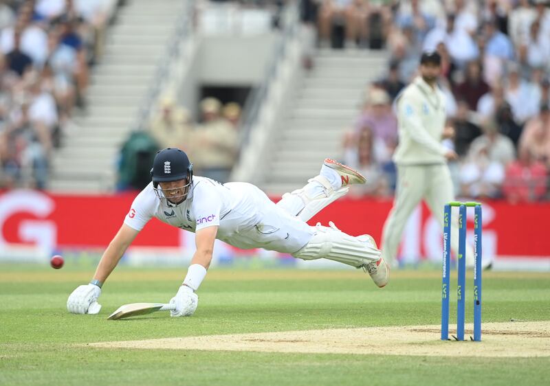 England's Jamie Overton dives to make his ground. Getty