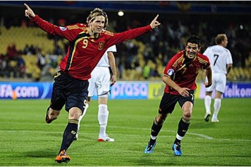 Fernando Torres, left, celebrates his first goal against New Zealand with his teammate David Villa as Spain run rampant in their opening Confederations Cup match.