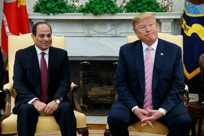 FILE - In this April 9, 2019 file photo, President Donald Trump meets with Egyptian President Abdel Fattah el-Sisi in the Oval Office of the White House in Washington. El-Sissi thanked Trump late Monday, Nov. 4,  for his "generous concern" for helping revive Egypt's deadlocked dispute with Ethiopia over its construction of a massive upstream Nile dam. (AP Photo/Evan Vucci, File)