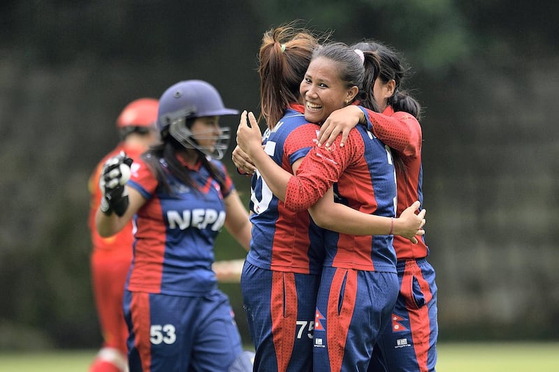 HONG KONG - OCTOBER 11: Rubina Chhetry Belbashi and Sabnam Rai of Nepal celebrate during their ICC 2016 Women's World Cup Asia Qualifier match between China and Nepal  on 11 October 2016 at the Kowloon Cricket Club in Hong Kong, Hong Kong. (Photo by Power Sport Images/Getty Images)