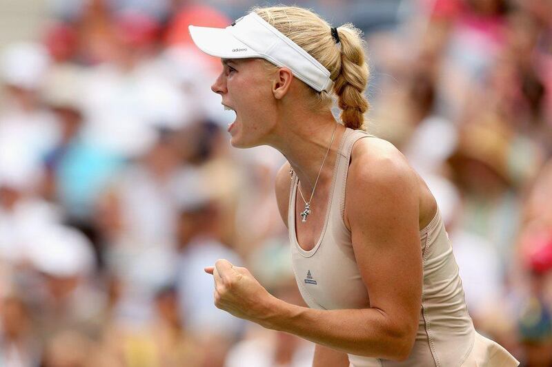 Caroline Wozniacki reacts during her fourth round win over Maria Sharapova on Sunday at the US Open. Matthew Stockman / Getty Images / AFP / August 31, 2014 