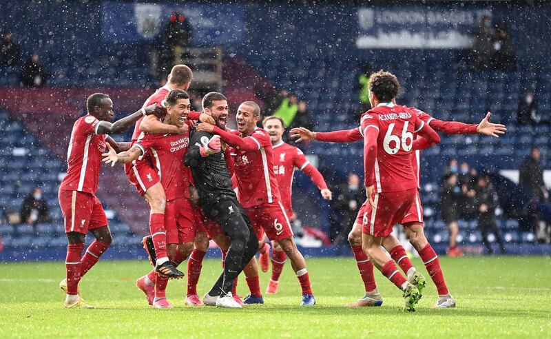 WEST BROMWICH, ENGLAND - MAY 16: Alisson Becker of Liverpool is congratulated by Sadio Mane, Roberto Firmino, Thiago Alcantara, Trent Alexander-Arnold and Fabinho after scoring the winning goal during the Premier League match between West Bromwich Albion and Liverpool at The Hawthorns on May 16, 2021 in West Bromwich, England. (Photo by Laurence Griffiths/Getty Images)