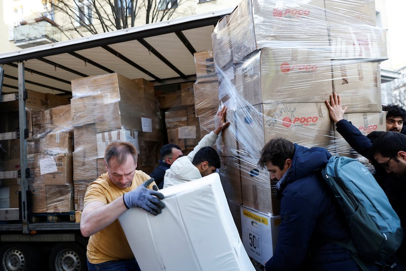 Members of the Turkish community in Berlin collect aid to support victims. Reuters