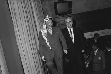 DAVOS/SWITZERLAND, JAN 1994 - Yasser Arafat, Chairman of the PLO, with Shimon Peres, Israeli Minister of Foreign Affairs at the Annual Meeting of the World Economic Forum in Davos in 1994.Copyright <a href="http://www.weforum.org">World Economic Forum</a> (<a href="http://www.weforum.org">http://www.weforum.org</a>)