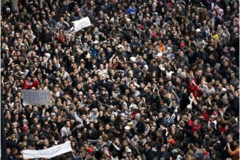 Protesters chant slogans against President Zine El Abidine Ben Aliin during a demonstration in Tunis. Thousands of demonstrators marched through Tunisia's capital, demanding the resignation of the country's leader a day after he appeared on TV to try to stop riots that have swept the nation.