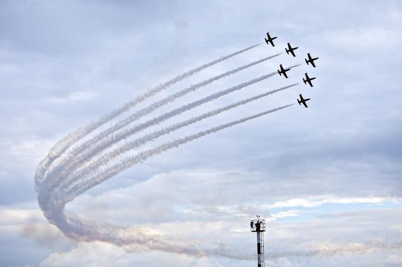 A jet formation, belonging to the civilian aerobatic team from Latvia called Baltic Bees, performs an aerial manoeuvre with their L-39C Albatross planes during the Chisinau International Air Show 2016 held to mark Civil Aviation Day at the International Airport of Chisinau, Moldova. EPA