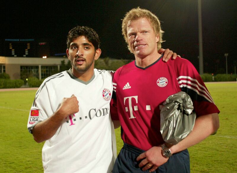 Sheikh Hamdan bin Mohammed with German goalkeeper and Bayern Munich captain Oliver Kahn during the team's Dubai training camp in 2004. Getty Images
