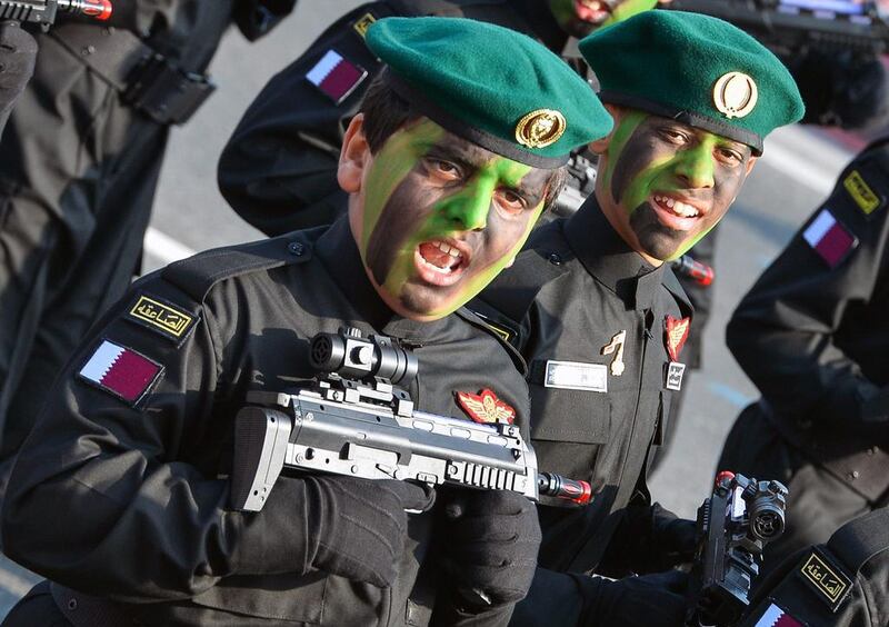 Qatari children dressed in Emiri Guard costumes.