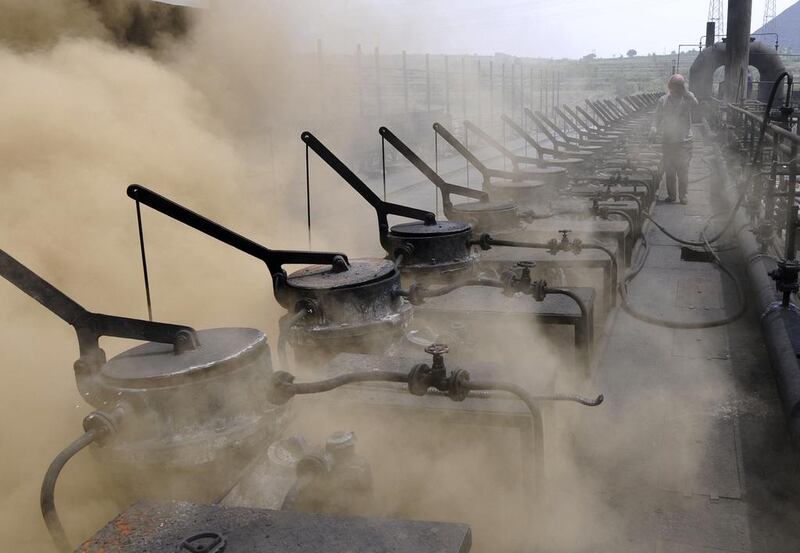 A worker walks past coking kilns at a coking plant on the outskirts of Changzhi, Shanxi province. Reuters