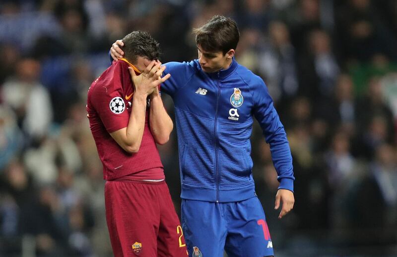Porto midfielder Oliver Torres, right, comforts Roma midfielder Alessandro Florenzi at the end of their Uefa Champions League last-16 second-leg match. Luis Vieira / AP Photo
