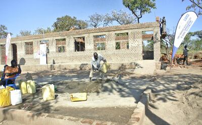 ADJUMANI DISTRICT, Uganda, Tuesday, November 28, 2017 // Bricklayers continue to build the new classrooms at Liberty Primary School Ayilo II refugee settlement in Northern Uganda Tuesday, Nov. 28, 2017 that is being funded by Dubai Cares. The three new classrooms will be completed in time for the start of the new academic year, in February. Dubai Cares partnered with Plan International to build new classrooms at the school for South Sudanese refugees. (Roberta Pennington/The National)