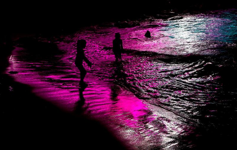 Palestinian children play on the shores of a beach in Gaza City.  AFP