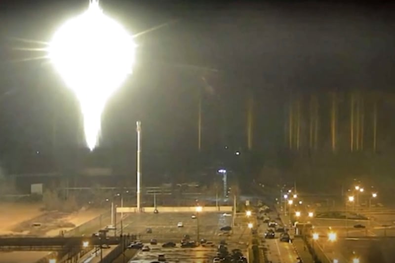 A bright object lands on the grounds of Zaporizhzhia nuclear power plant in Enerhodar, Ukraine, during heavy shelling by Russian forces. AP