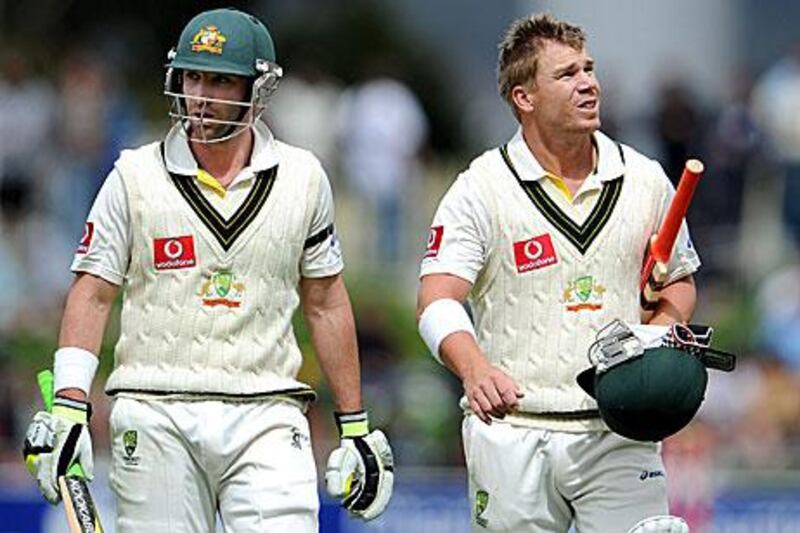 Phil Hughes, left, and David Warner are guiding Australia towards victory.