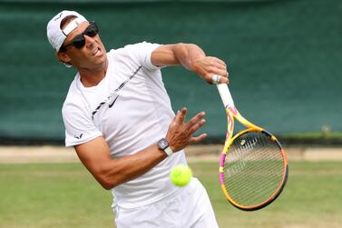 LONDON, ENGLAND - JUNE 25: Rafael Nadal of Spain wears sunglasses as they serve during their training session ahead of The Championships Wimbledon 2022 at All England Lawn Tennis and Croquet Club on June 25, 2022 in London, England. (Photo by Clive Brunskill / Getty Images)