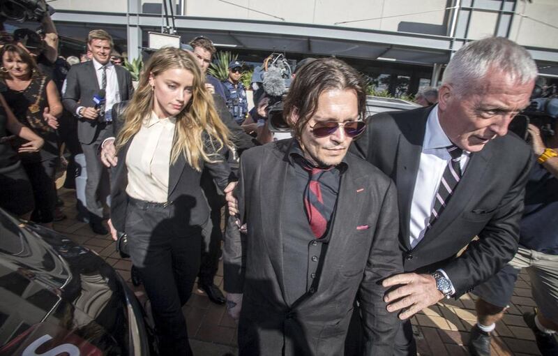 Johnny Depp and his wife, Amber Heard, leave the Southport Magistrates Court on Australia’s Gold Coast on April 18. Dave Hunt / AAP / Reuters