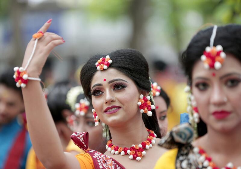 Indian students perform a dance to a Tagore song as they celebrate the Holi festival at Tagore University in Kolkata, eastern India. The Rabindra Bharati University organized the festival of colors at their campus. Holi is an ancient Indian festival to mark the arrival of spring.  EPA